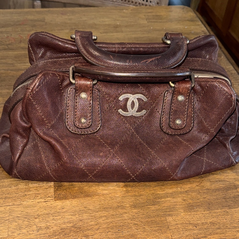 CHANEL Quilted Brown Leather Bag with Silver Logo